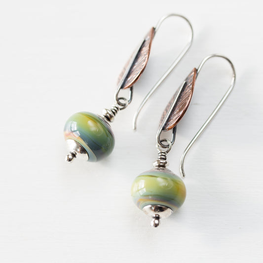 Pastel Green Earrings, hammered copper leaf with lampwork beads - jewelry by CookOnStrike