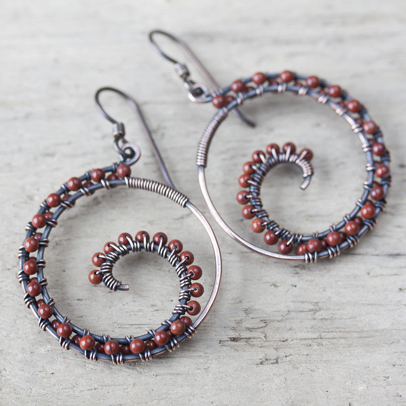 Dark brown oxidized copper wire wrapped spiral hoop earrings with red jasper beads - jewelry by CookOnStrike