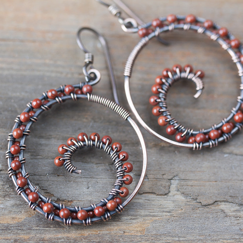 Dark brown oxidized copper wire wrapped spiral hoop earrings with red jasper beads - jewelry by CookOnStrike