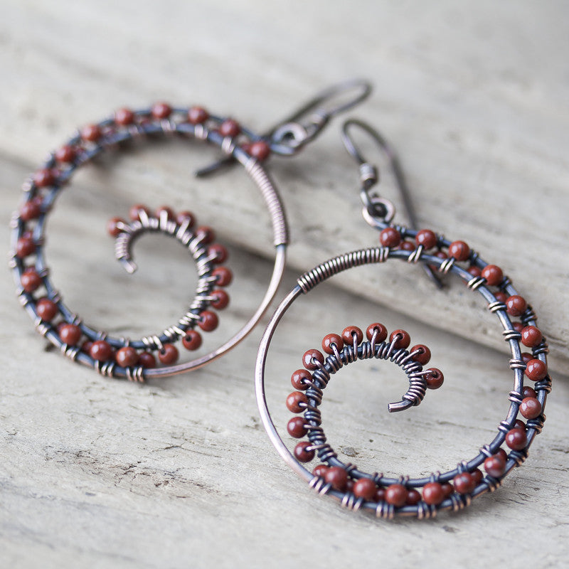 Dark brown oxidized copper wire wrapped spiral hoop earrings with red jasper beads - jewelry by CookOnStrike