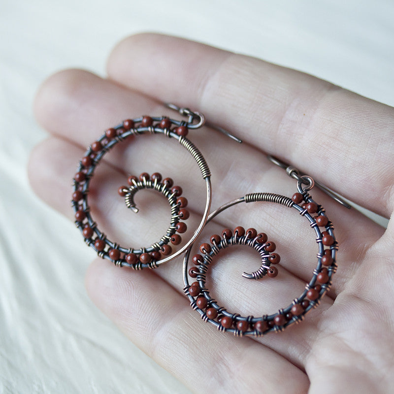 Dark brown oxidized copper wire wrapped spiral hoop earrings with red jasper beads - jewelry by CookOnStrike