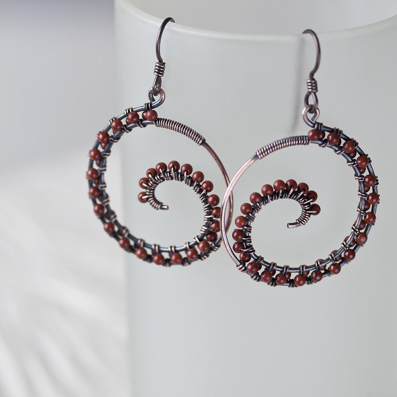 Dark brown oxidized copper wire wrapped spiral hoop earrings with red jasper beads - jewelry by CookOnStrike